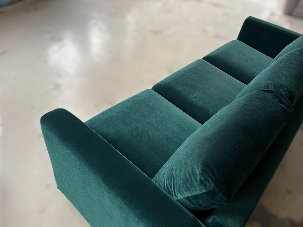 Dark green velvet sofa