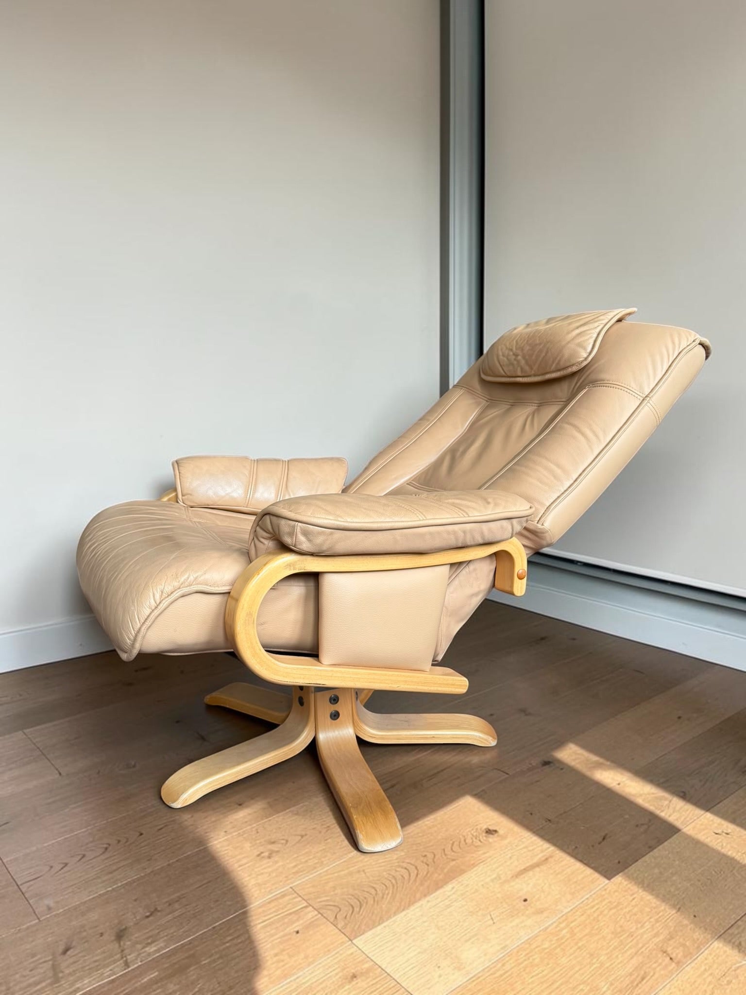 Leather lounge chair with footstool