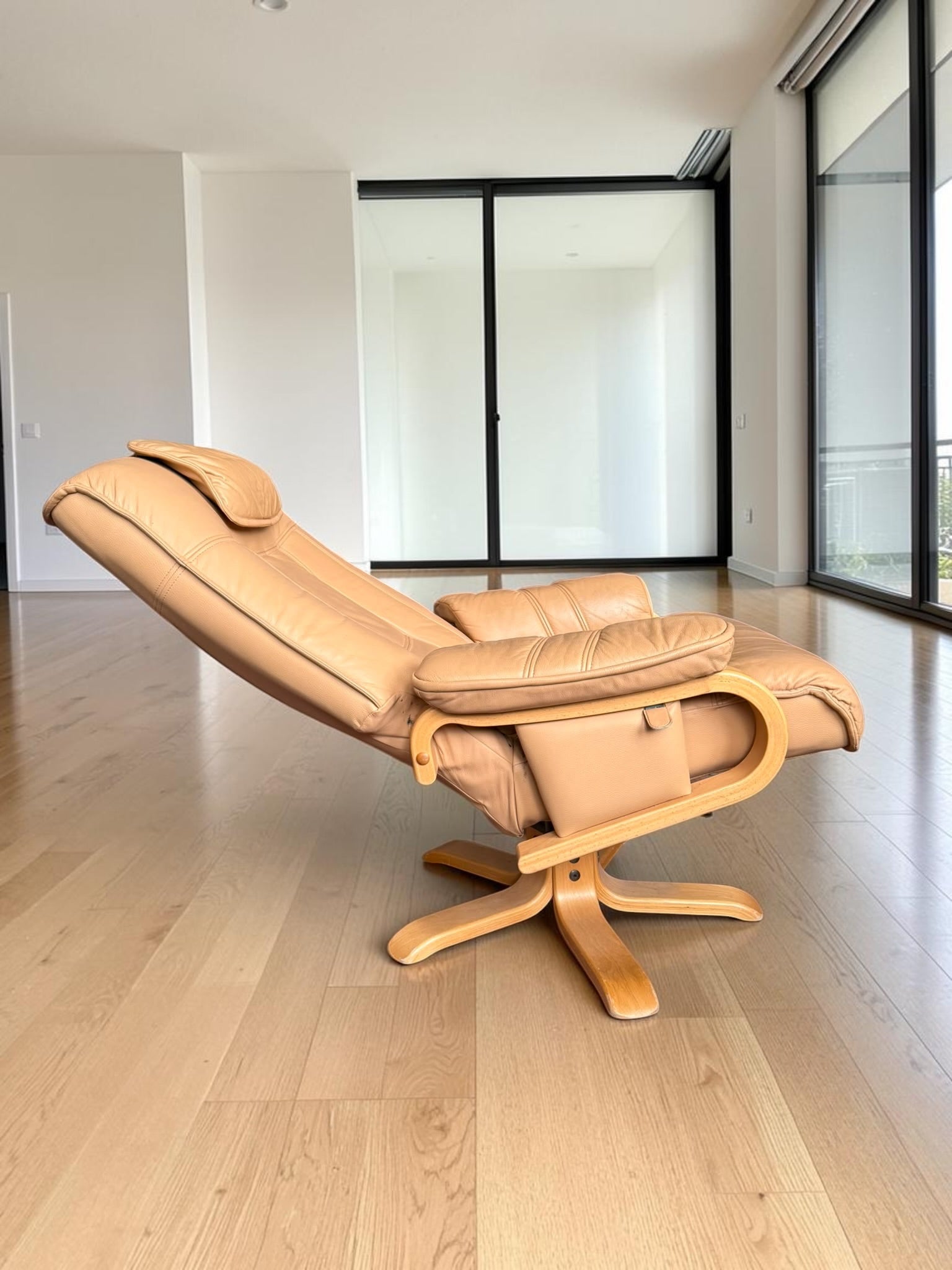 Leather lounge chair with footstool