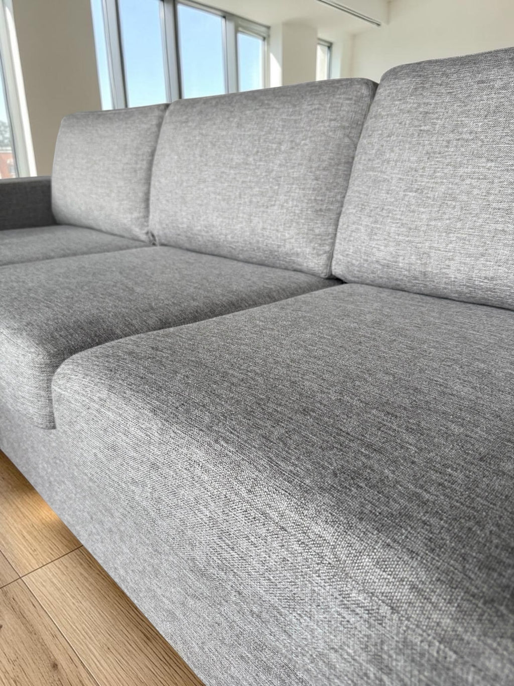 Modern light gray corner sofa