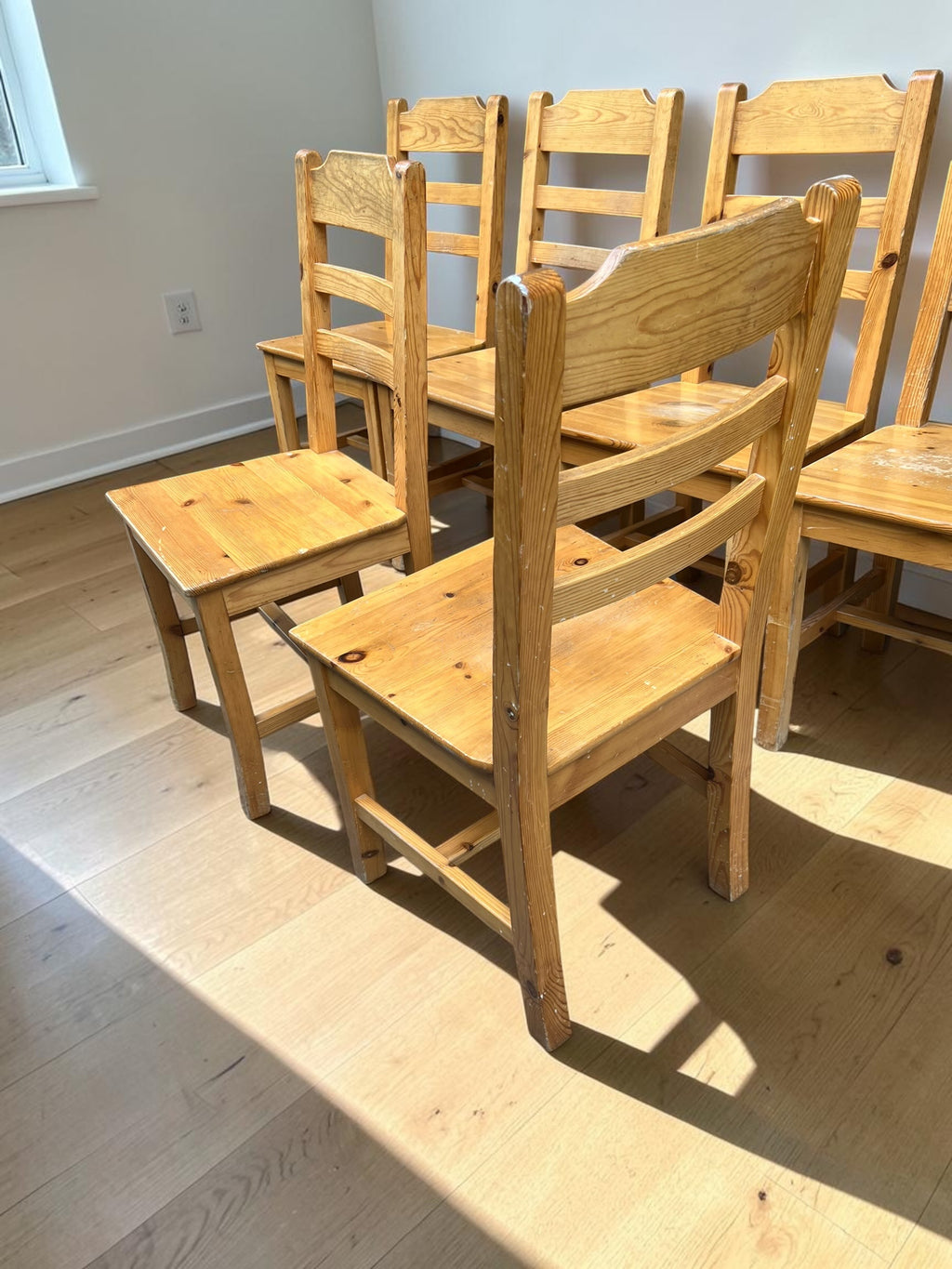 a set of 6 wooden dining chairs
