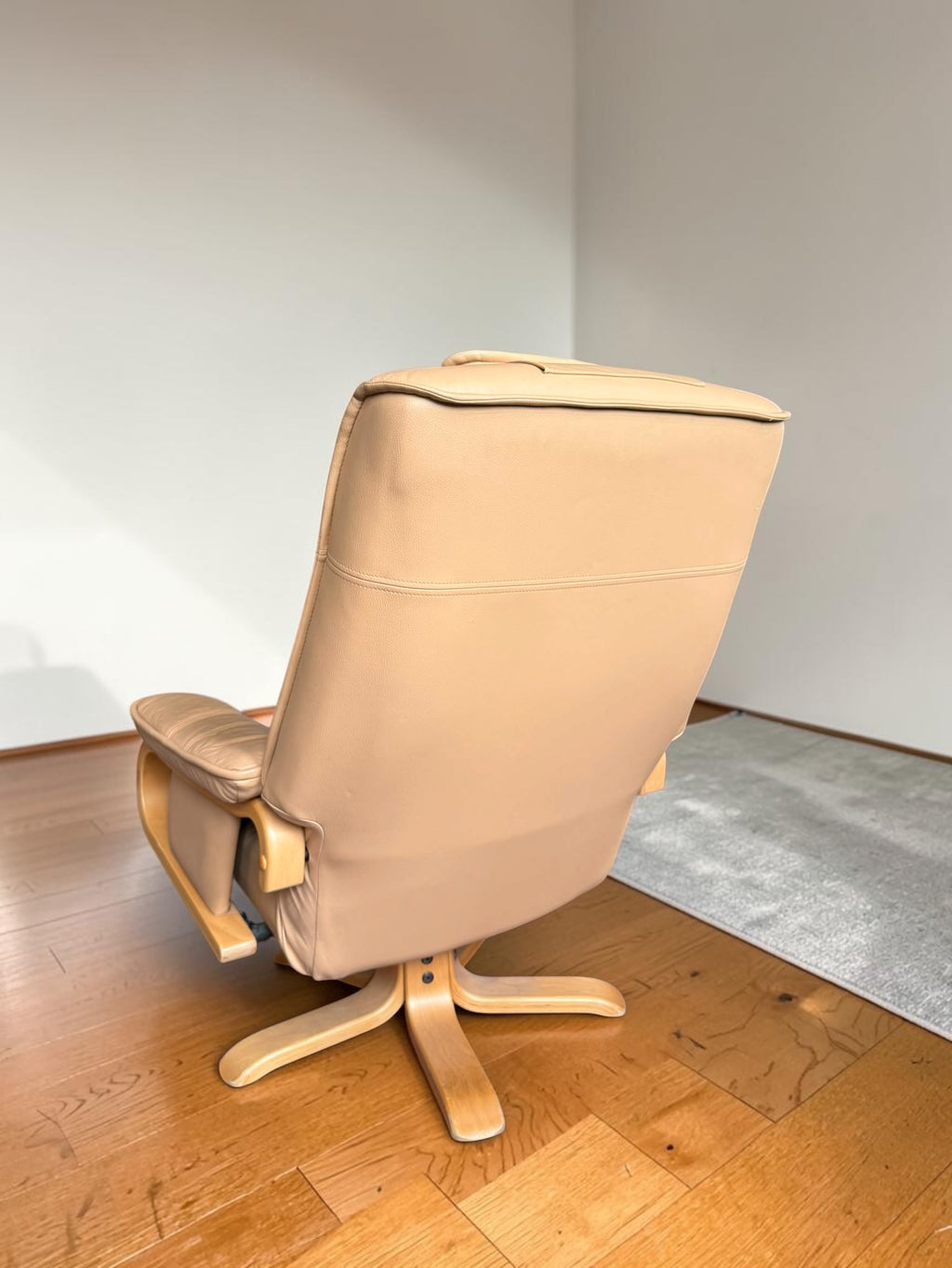 Leather lounge chair with footstool