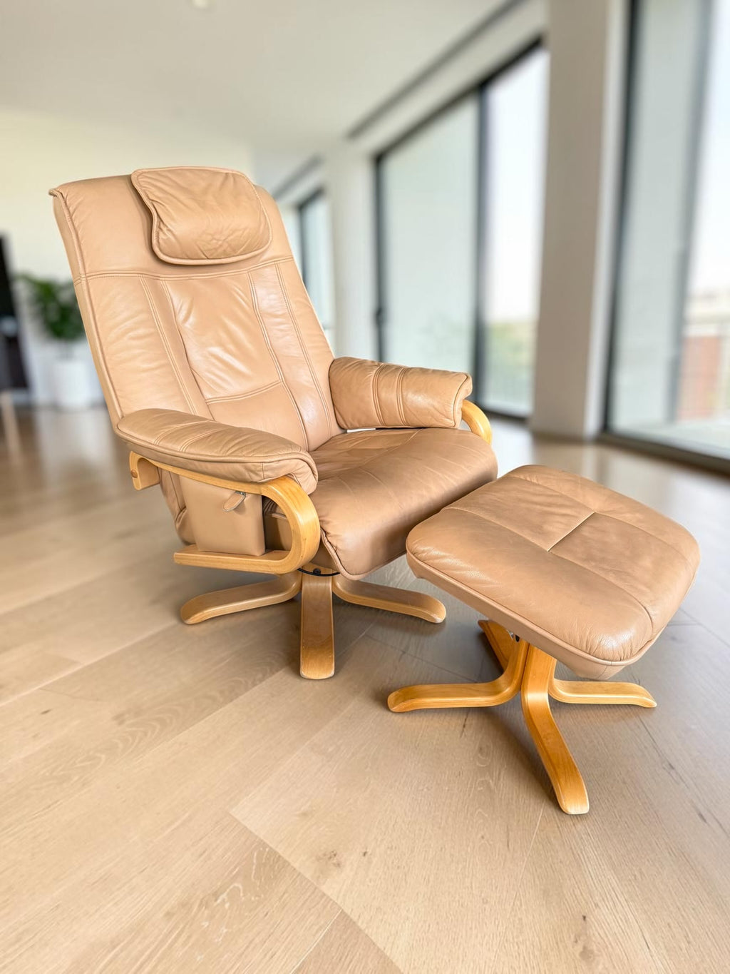 Leather lounge chair with footstool