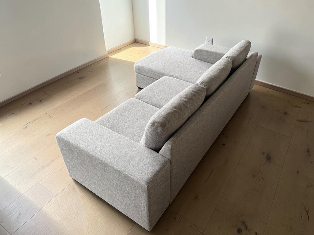 Modern light gray corner sofa