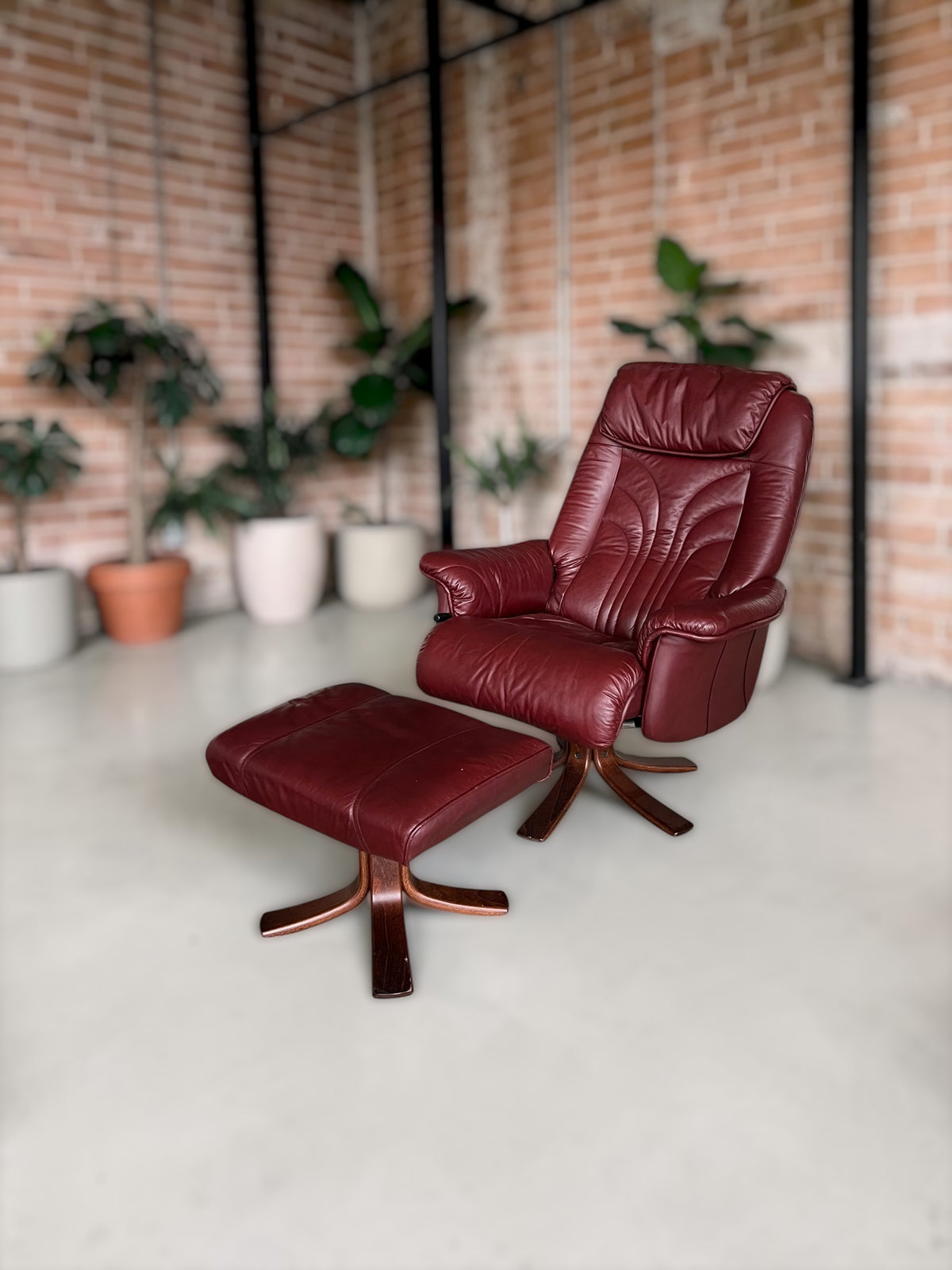 Leather lounge chair with footstool