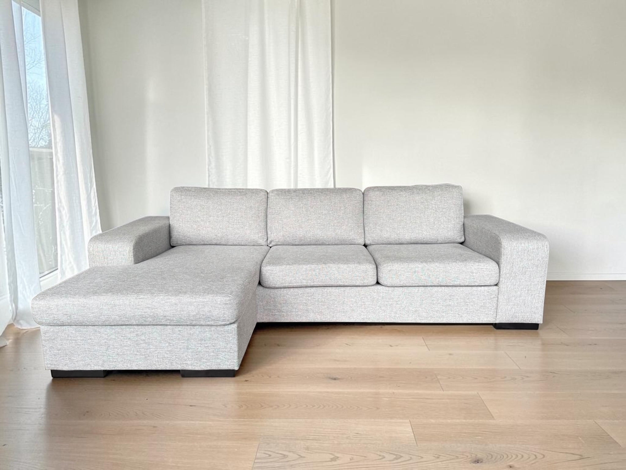 Modern light gray corner sofa