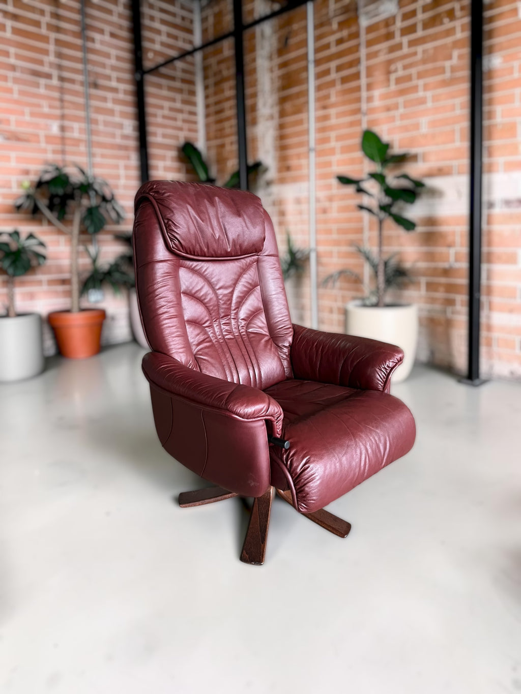 Leather lounge chair with footstool