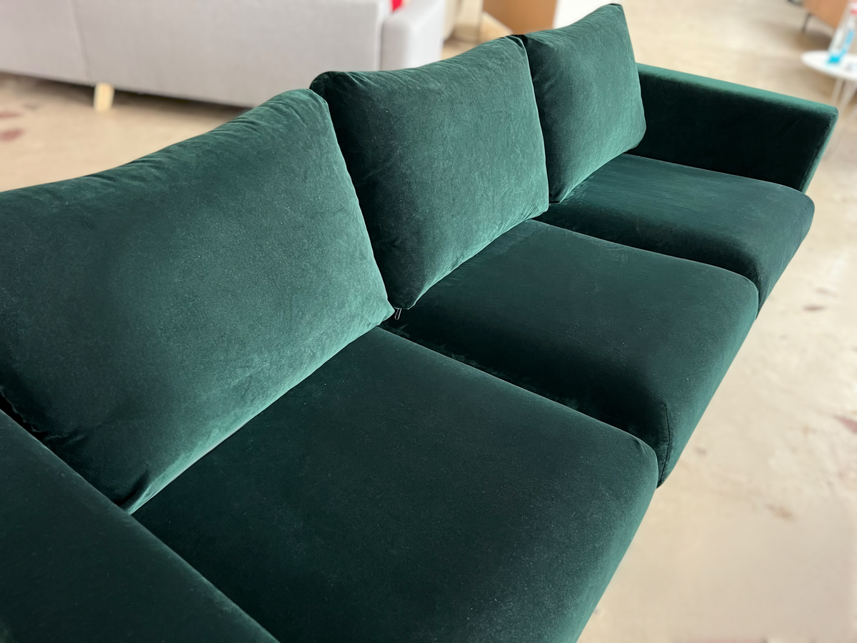 Dark green velvet sofa