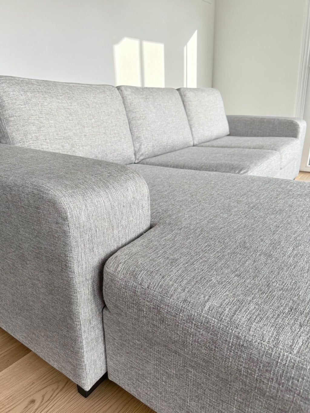 Modern light gray corner sofa