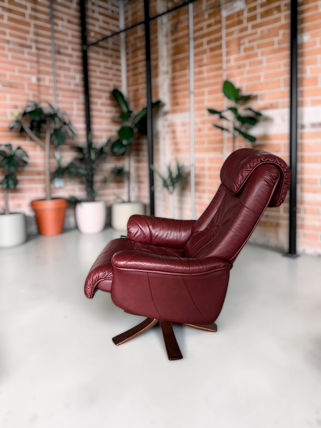 Leather lounge chair with footstool