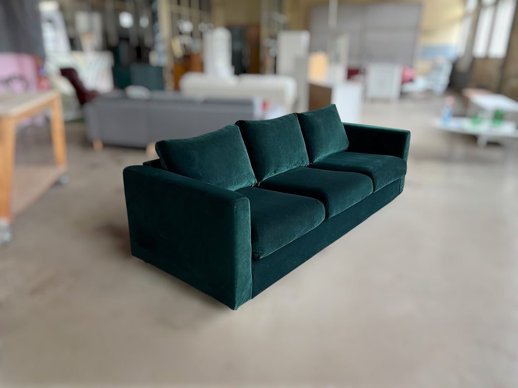 Dark green velvet sofa