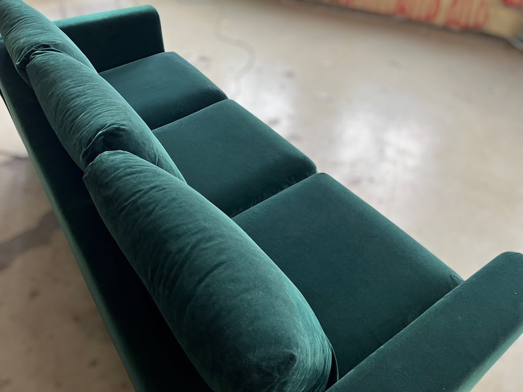 Dark green velvet sofa