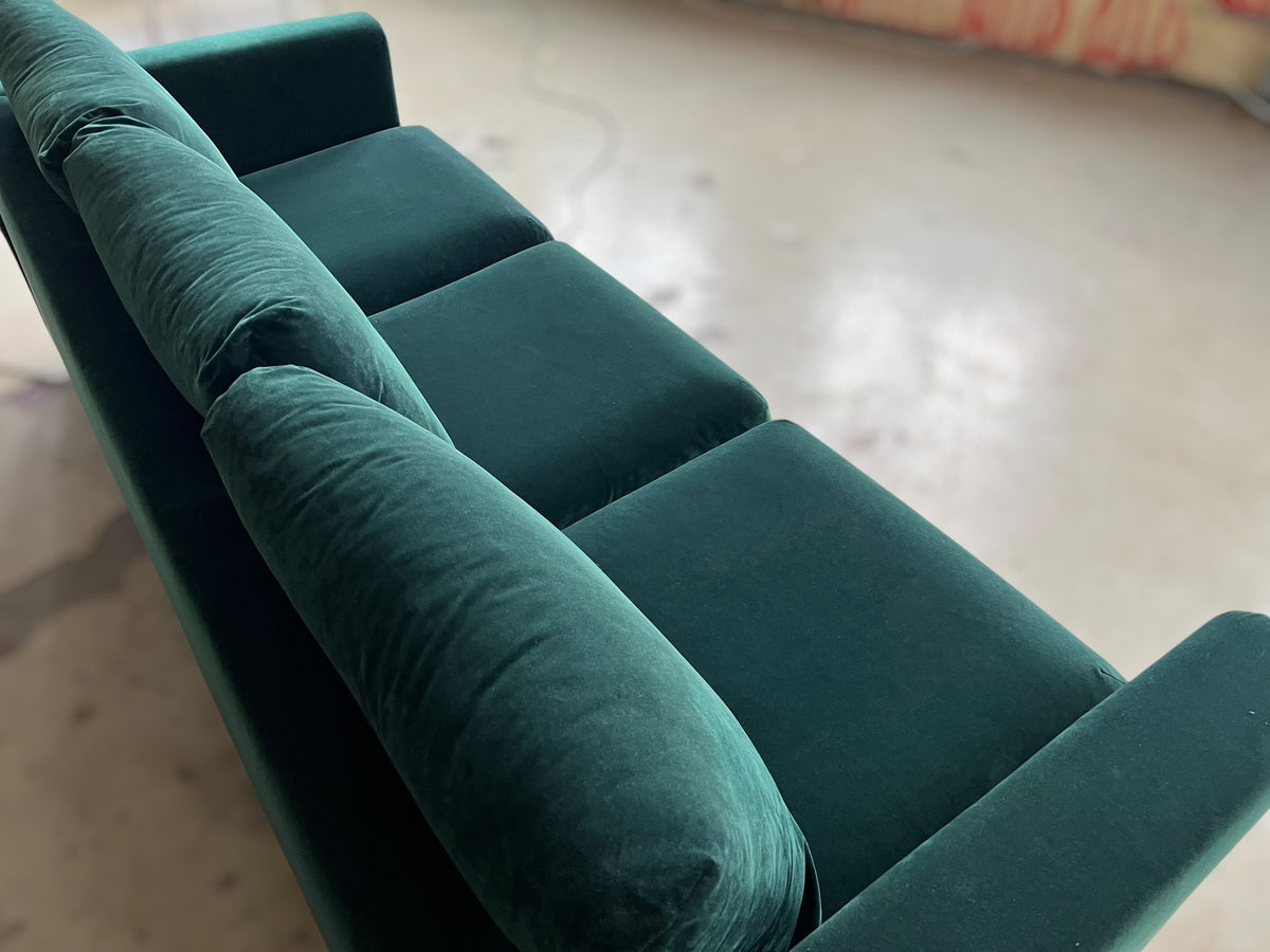 Dark green velvet sofa