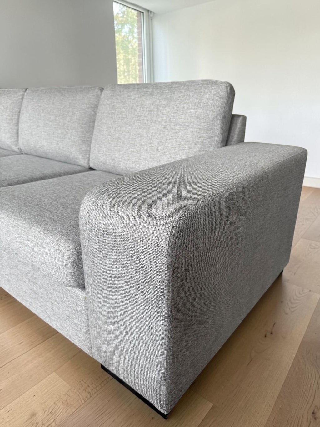 Modern light gray corner sofa