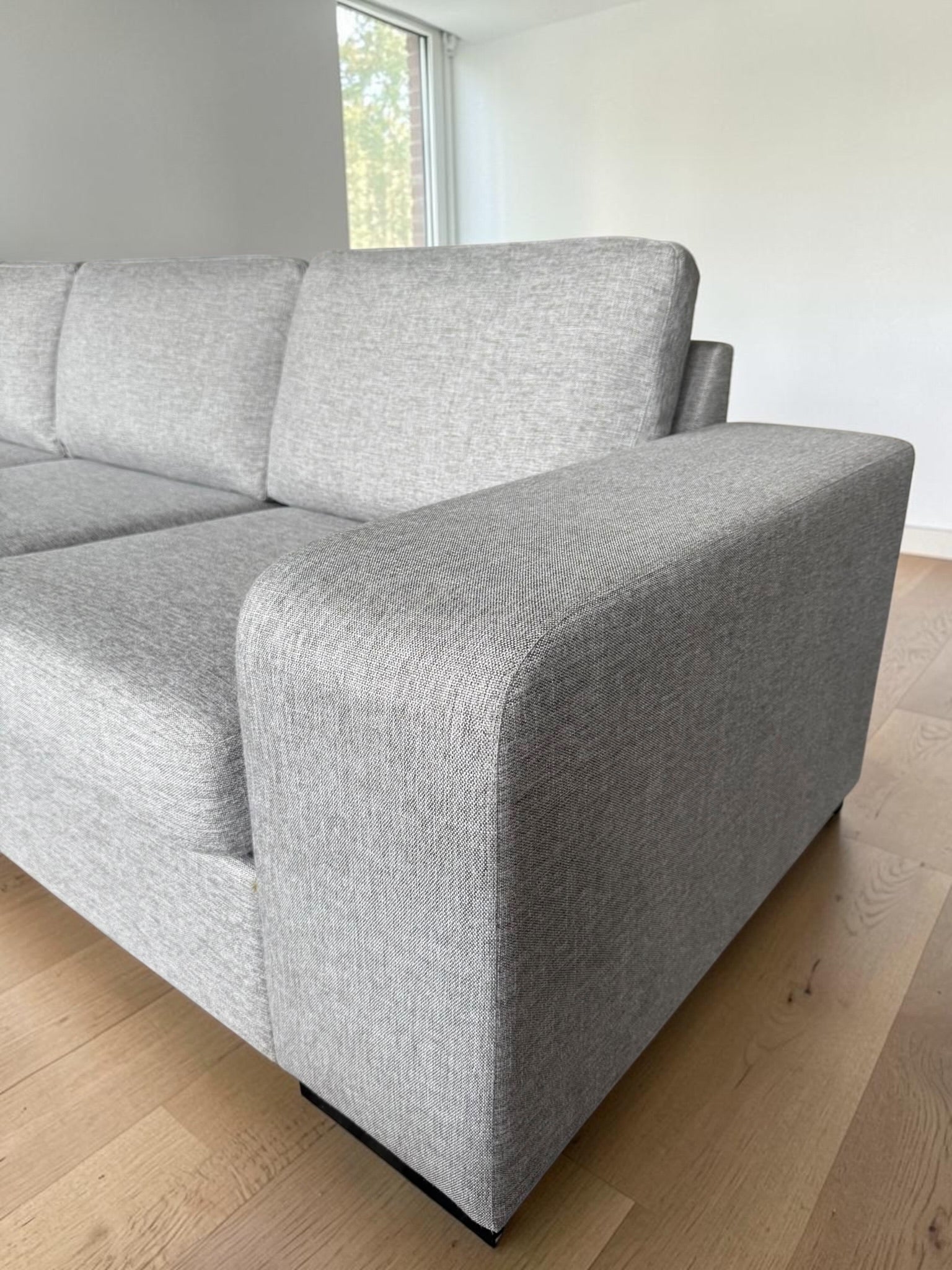Modern light gray corner sofa