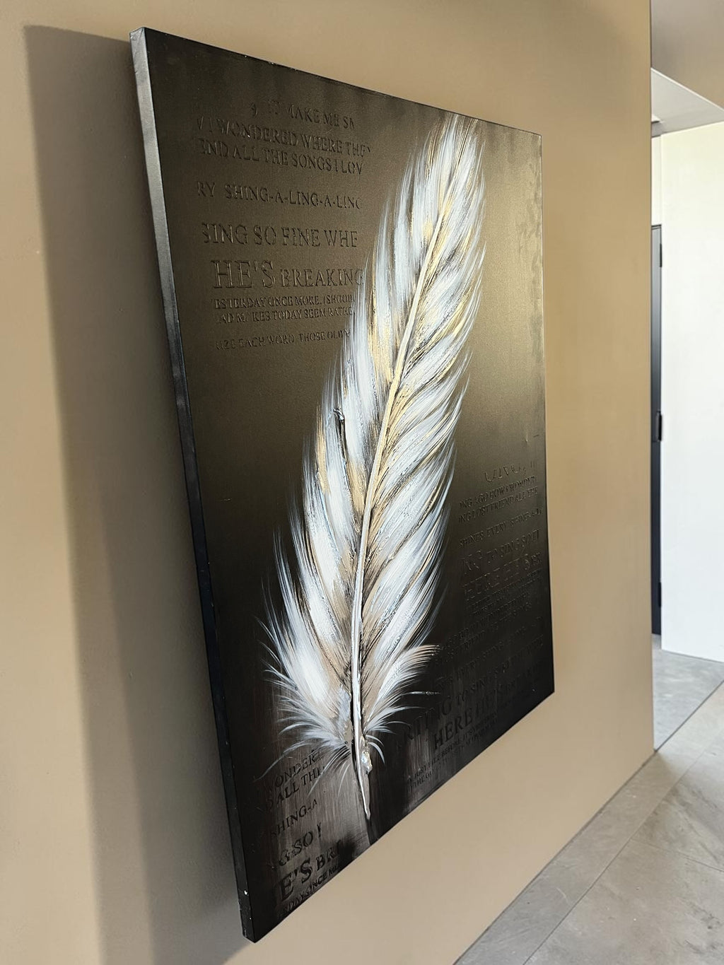 Painting featuring text and a giant feather